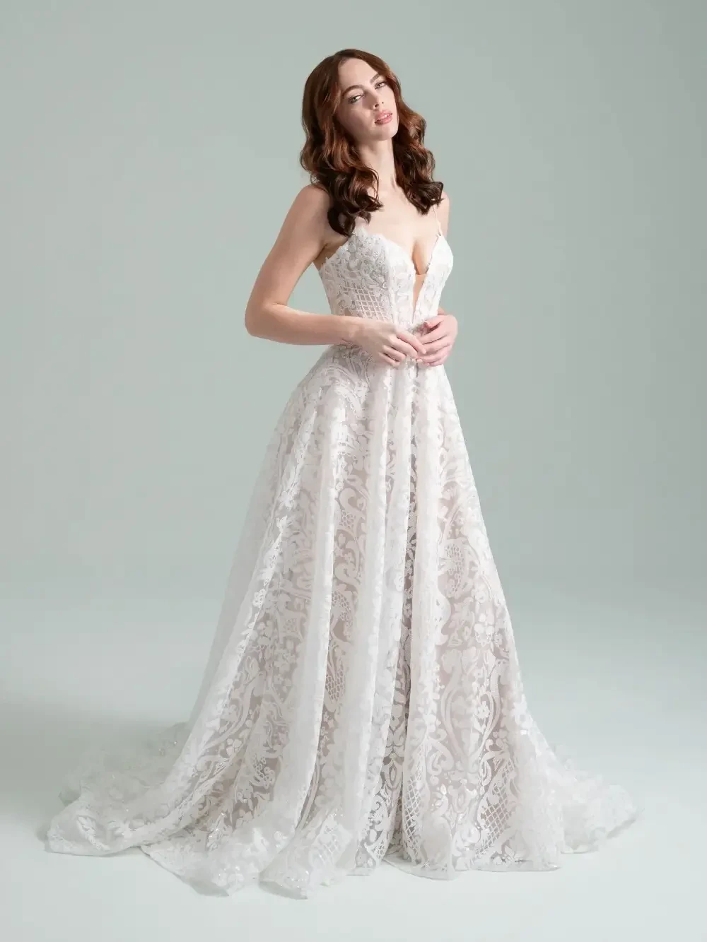 model is wearing a sleeveless bridal gown